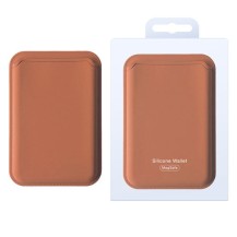 Porte carte MagSafe marron fixé sur un iPhone